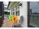 View of outdoor patio with brick flooring, colorful pool floats, and comfortable seating at 1417 Carswell St, Port Charlotte, FL 33953