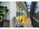 Poolside view of colorful pool floaties and patio chairs along the side of the home at 1417 Carswell St, Port Charlotte, FL 33953