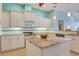 Charming kitchen featuring granite countertops, modern appliances, and ample cabinet space at 1616 Palmetto Palm Way, North Port, FL 34288