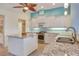 Functional kitchen with granite countertops, stainless steel appliances, and a center island at 1616 Palmetto Palm Way, North Port, FL 34288
