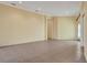 Spacious living room with tile flooring and large windows, ready for personalization and comfort at 1616 Palmetto Palm Way, North Port, FL 34288