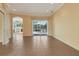 Bright, open living space with tile floors and sliding glass doors overlooking the pool, enhancing indoor/outdoor living at 1616 Palmetto Palm Way, North Port, FL 34288