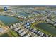 An aerial view showcases a lakeside community with a focus on the neighborhood's attractive location at 17917 Wayside Bnd, Punta Gorda, FL 33982