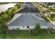 Aerial view of home with well-kept lawn, mature trees, and surrounding lush landscaping at 17917 Wayside Bnd, Punta Gorda, FL 33982