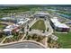 Aerial view of the future school, sports complex, and community amenities within the neighborhood at 17917 Wayside Bnd, Punta Gorda, FL 33982