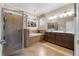 Large bathroom features a walk-in shower, soaking tub, and double vanity at 17917 Wayside Bnd, Punta Gorda, FL 33982