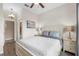 Bedroom features wood-look floors, light grey walls, and an ensuite bathroom at 17917 Wayside Bnd, Punta Gorda, FL 33982