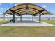 Open-air pavilion with arched roof, offering waterfront views and ample space for community gatherings at 17917 Wayside Bnd, Punta Gorda, FL 33982