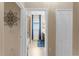 Hallway view into bathroom with blue accents and vanity at 17917 Wayside Bnd, Punta Gorda, FL 33982