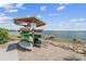 Kayak storage rack with various kayaks and boat storage near a calm waterfront at 17917 Wayside Bnd, Punta Gorda, FL 33982
