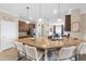Modern kitchen with granite countertops, stainless steel appliances, and a large island with bar seating at 17917 Wayside Bnd, Punta Gorda, FL 33982