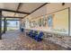 Covered outdoor seating area with comfortable blue chairs and a view of the scenic waterfront at 17917 Wayside Bnd, Punta Gorda, FL 33982