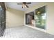 Screened patio features ceiling fan, brick flooring and an open view of interior spaces at 17917 Wayside Bnd, Punta Gorda, FL 33982