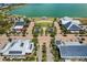 Aerial view of a town center featuring solar panels, green spaces, and palm-lined streets at 17917 Wayside Bnd, Punta Gorda, FL 33982