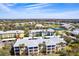 Complex aerial view highlighting landscaping, amenities, and nearby community features at 2081 Willow Hammock Cir # F101, Punta Gorda, FL 33983