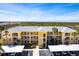 Aerial view showcasing the building with a well maintained parking area at 2081 Willow Hammock Cir # F101, Punta Gorda, FL 33983