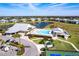 Community clubhouse and pool with a building on the side of the pool and parking available at 2081 Willow Hammock Cir # F101, Punta Gorda, FL 33983