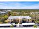 Community aerial view showing well-kept buildings, parking, and scenic surroundings at 2081 Willow Hammock Cir # F101, Punta Gorda, FL 33983