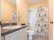 Bathroom with single sink, tile floors, and shower with a decorative curtain at 2081 Willow Hammock Cir # F101, Punta Gorda, FL 33983