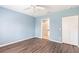 Bedroom with wood floors, double closet, and entry into the en-suite bathroom at 2081 Willow Hammock Cir # F101, Punta Gorda, FL 33983