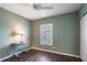Bedroom with wood floors, white trim, and plantation shutters on the window at 2081 Willow Hammock Cir # F101, Punta Gorda, FL 33983