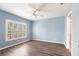 Bedroom featuring wood floors, a ceiling fan and a window with plantation shutters at 2081 Willow Hammock Cir # F101, Punta Gorda, FL 33983