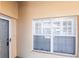 A door and large shuttered window viewed from an exterior wall at 2081 Willow Hammock Cir # F101, Punta Gorda, FL 33983