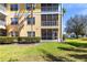 Well-maintained building exterior featuring a private screened lanai at 2081 Willow Hammock Cir # F101, Punta Gorda, FL 33983