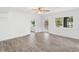 Bright bedroom with neutral walls, wood-look floors, ceiling fan and lots of natural light at 23475 Harper Ave, Port Charlotte, FL 33980