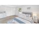 Staged bedroom featuring updated flooring and natural light at 23475 Harper Ave, Port Charlotte, FL 33980
