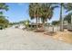 Wide shot of the backyard showing the lush greenery and a tranquil setting at 23475 Harper Ave, Port Charlotte, FL 33980