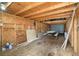 Spacious garage interior with wood construction, a metal door, and ample storage capacity at 23475 Harper Ave, Port Charlotte, FL 33980