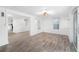 Bright living room featuring wood floors, white walls and trim, and lots of natural light at 23475 Harper Ave, Port Charlotte, FL 33980