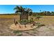 Community sign with landscaping for Burnt Store Lakes Canoe Kayak Launch Property Owners Only at 24362 Peppercorn Rd, Punta Gorda, FL 33955