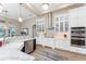 Bright kitchen with white cabinetry, marble countertops, and stainless-steel appliances at 24362 Peppercorn Rd, Punta Gorda, FL 33955