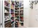 Organized pantry with custom shelves, ample storage space, and a built-in wine cooler at 24362 Peppercorn Rd, Punta Gorda, FL 33955
