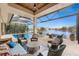 Elegant outdoor patio with comfortable seating and a beautiful pool and lake view at 24362 Peppercorn Rd, Punta Gorda, FL 33955