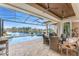 Charming screened-in pool featuring a hot tub overlooking a beautiful lake at 24362 Peppercorn Rd, Punta Gorda, FL 33955