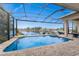 Refreshing screened-in pool and spa with peaceful waterfront views at 24362 Peppercorn Rd, Punta Gorda, FL 33955