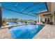 Sparkling screened-in pool and spa overlooking scenic lake views at 24362 Peppercorn Rd, Punta Gorda, FL 33955