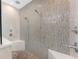 Large glass shower with dual shower heads and mosaic tile surround with built-in bench seating at 24362 Peppercorn Rd, Punta Gorda, FL 33955