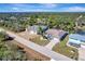 Scenic aerial view of a neighborhood with waterfront properties surrounded by lush vegetation at 3415 Knox Ter, Port Charlotte, FL 33948