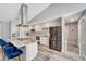 Modern kitchen with stainless steel appliances, white cabinetry, granite countertops, and a breakfast bar at 3415 Knox Ter, Port Charlotte, FL 33948