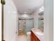 Bathroom featuring a marble shower, toilet, and vanity with lights at 399 Bal Harbor Blvd, Punta Gorda, FL 33950