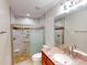 Bathroom featuring a marble shower, toilet, and vanity at 399 Bal Harbor Blvd, Punta Gorda, FL 33950