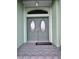 Elegant front entry featuring arched glass doors, a welcoming entrance, and neutral accents at 399 Bal Harbor Blvd, Punta Gorda, FL 33950
