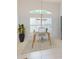 Bright home office with clear glass desk, natural light, and simple decor for a clean and productive workspace at 399 Bal Harbor Blvd, Punta Gorda, FL 33950