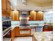 Gourmet kitchen featuring granite countertops, stainless steel appliances, and modern fixtures at 399 Bal Harbor Blvd, Punta Gorda, FL 33950
