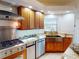 Updated kitchen boasting granite counters, a stainless steel sink, and appliances at 399 Bal Harbor Blvd, Punta Gorda, FL 33950