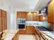 Modern kitchen with stainless steel appliances, custom cabinets, and an island for extra prep space at 399 Bal Harbor Blvd, Punta Gorda, FL 33950